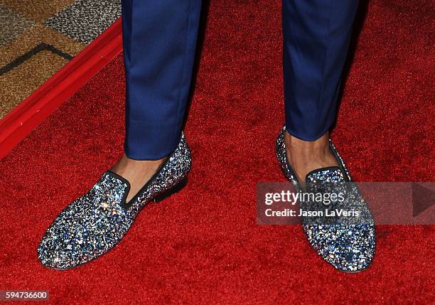 Nick Cannon, shoe detail, attends the "America's Got Talent" season 11 live show at Dolby Theatre on August 23, 2016 in Hollywood, California.