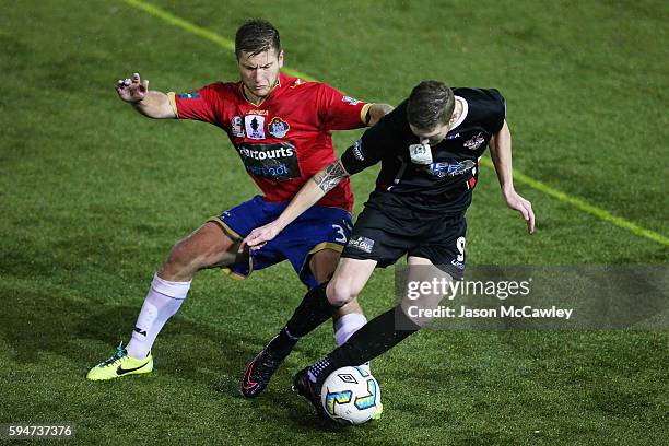 Joey Gibbs of Blacktown is challenged by David Vrankovic of Bonnyrigg during the round 16 FFA Cup match between Blacktown City and Bonnyrigg White...