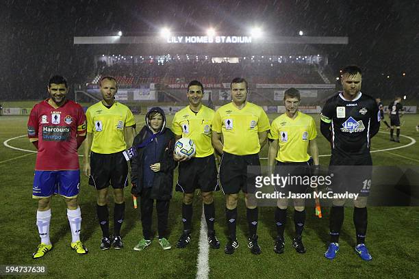 Players and officials line up before the round 16 FFA Cup match between Blacktown City and Bonnyrigg White Eagles at Lilys Football Stadium on August...