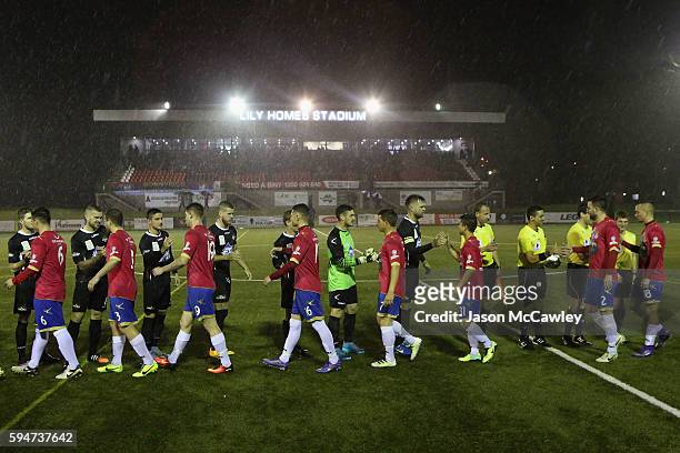 Players shake hands before the round 16 FFA Cup match between Blacktown City and Bonnyrigg White Eagles at Lilys Football Stadium on August 24, 2016...