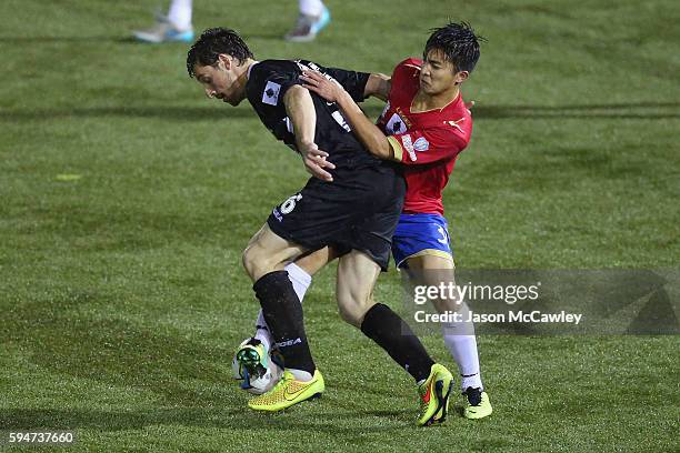 Patrick Antelmi of Blacktown is challenged by Martin Lo of Bonnyrigg during the round 16 FFA Cup match between Blacktown City and Bonnyrigg White...