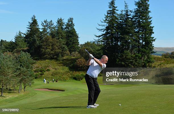 Professional Richard Green plays his second shot to the 12th during the PGA Super 60s Tournament at Gleneagles on August 24, 2016 in Auchterarder,...