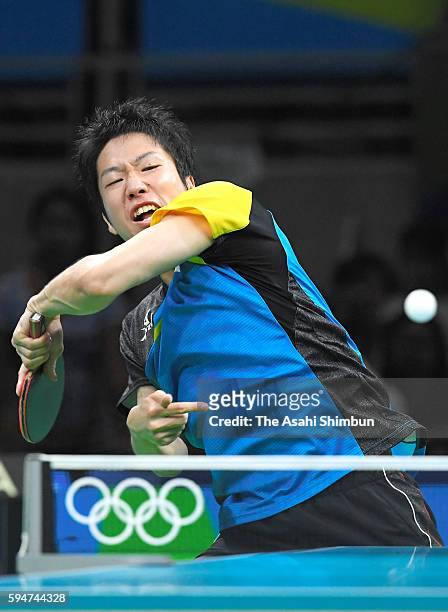Jun Mizutani of Japan competes against Xu Xin of China during the the Men's Team Table Tennis gold medal match on Day 12 of the Rio 2016 Olympic...