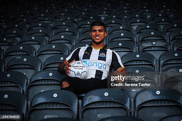 DeAndre Yedlin sits in the stands wearing a club shirt and holding a football after signing a 5 year contract at St.James' Park on August 24 in...