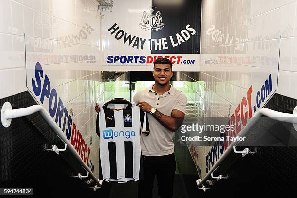 DeAndre Yedlin holds a club shirt in the tunnel after signing a 5 year contract at St.James' Park on August 24 in Newcastle upon Tyne, England.