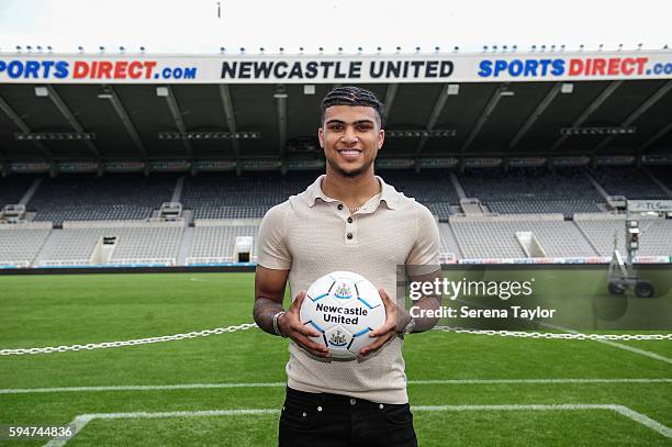 DeAndre Yedlin holds a football pitch side after signing a 5 year contract at St.James' Park on August 24 in Newcastle upon Tyne, England.