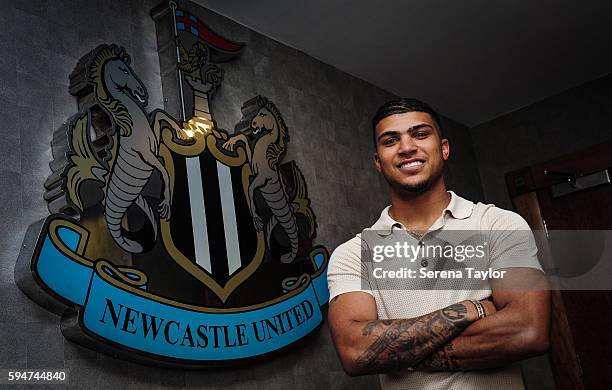 DeAndre Yedlin poses for photographs with the club crest after signing a 5 year contract at St.James' Park on August 24 in Newcastle upon Tyne,...