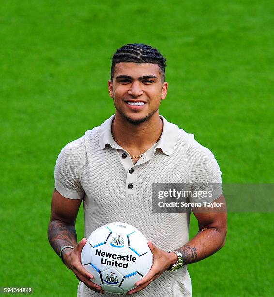 DeAndre Yedlin holds a football on the pitch after signing a 5 year contract at St.James' Park on August 24 in Newcastle upon Tyne, England.