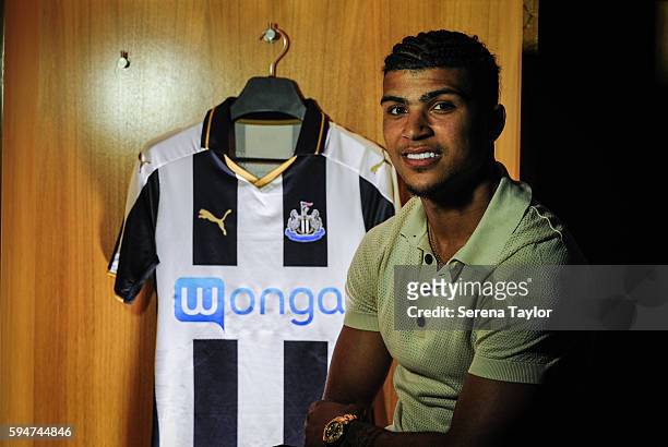 DeAndre Yedlin poses for a photograph in the dressing room with a club shirt after signing a 5 year contract at St.James' Park on August 24 in...