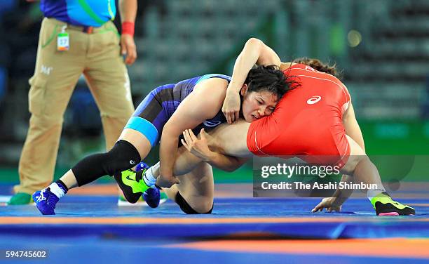 Sara Dosho of Japan and Natalia Vorobeva of Russia compete in the gold medal after the Women's 69kg gold medal contest on Day 12 of the Rio 2016...