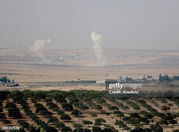 The photo taken from Karkamis district of the Turkey's Gaziantep province shows smoke rising as the Turkish fighter jets bomb Daesh targets in...