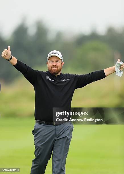 Shane Lowry of Ireland plays to the cameras after a fine second shot on the 18th hole during the Pro Am prior to the start of Made In Denmark at...