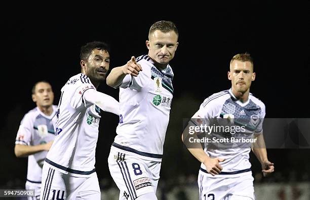 Besart Berisha of Melbourne Victory celebrates after scoring his sides first goal with Fahid Ben Khalfallah during the FFA Cup Round of 16 match...