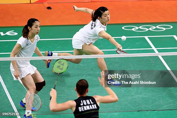 Misaki Matsutomo and Ayaka Takahashi of Japan celebrate a point against Christinna Pedersen and Kamilla Rytter Juhl of Denmark during the Women's...