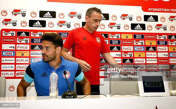 Olympiaco's Portuguese head coach Paulo Bento and Olympiaco's Spanish defender Alberto Botia during the press conference of UEFA Europa League match...