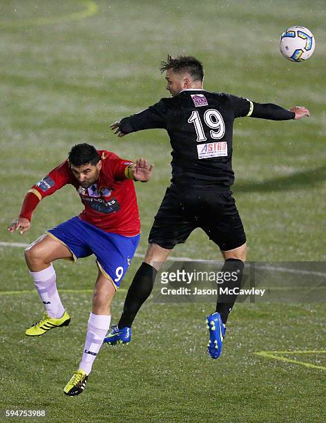 Zach Cairncross of Blacktown is challenged by Robert Younis of Bonnyrigg during the round 16 FFA Cup match between Blacktown City and Bonnyrigg White...