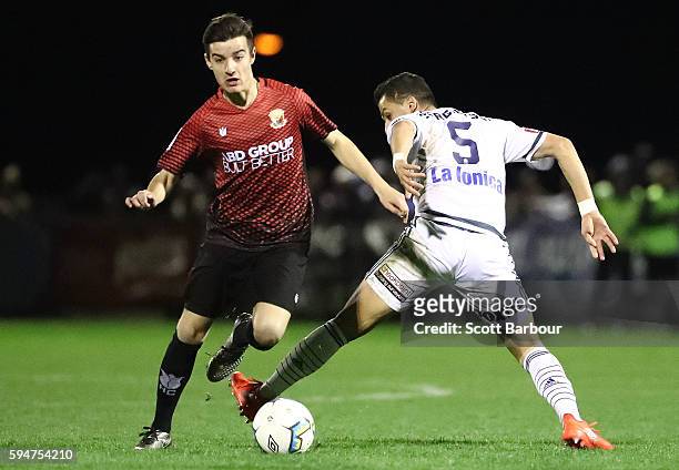 Kristian Trajceski of Hume City and Daniel Georgievski of Melbourne Victory compete for the ball during the FFA Cup Round of 16 match between Hume...