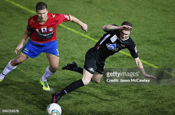 Joey Gibbs of Blacktown is challenged by David Vrankovic of Bonnyrigg during the round 16 FFA Cup match between Blacktown City and Bonnyrigg White...