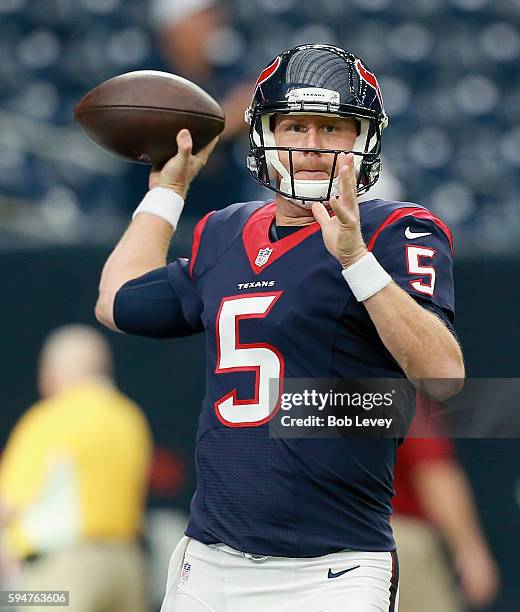 Brandon Weeden of the Houston Texans throws a pass during warm ups before playing the New Orleans Saints during a preseason NFL game at NRG Stadium...