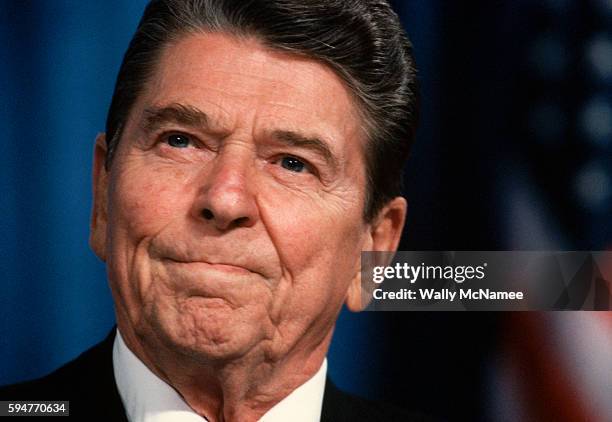 President Ronald Reagan, campaigning for 1988 Republican presidential candidate George Bush, makes a face during a speech at a rally in Cincinnati.