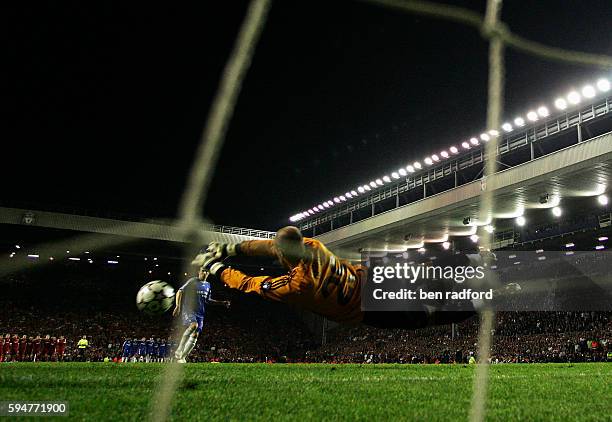 Pepe Reina of Liverpool saves from Arjen Robben during the penalty shoot-out during the Champions League Semi-Final 2nd Leg between Liverpool and...