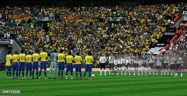 The two teams observe a one minute applause in memory of former England player Alan Ball who died in April 2007 before the international friendly...