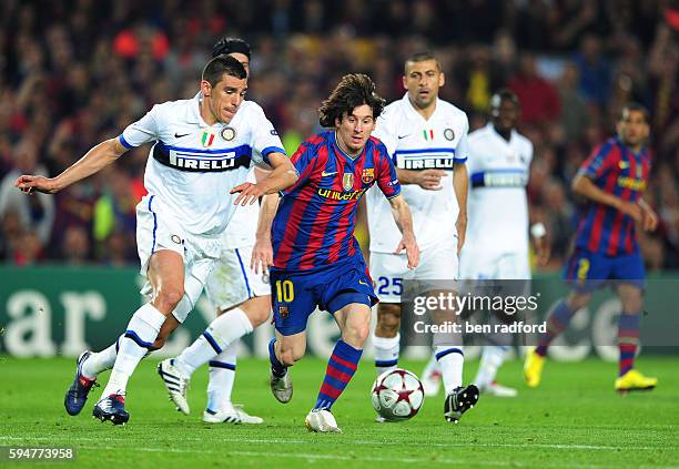 Lionel Messi of Barcelona and Lucio of Inter Milan during the UEFA Champions League Semi Final 2nd Leg match between Barcelona and Inter Milan at the...