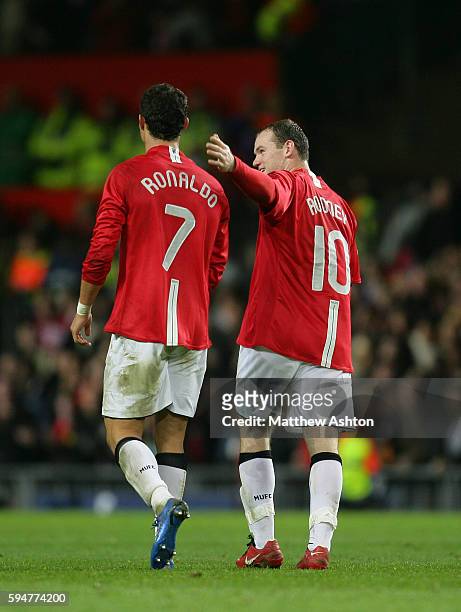 After scoring the fourth goal, Cristiano Ronaldo of Manchester United gets congratulations from Wayne Rooney