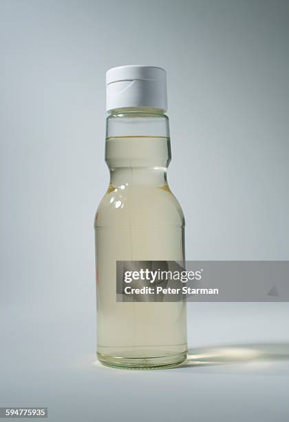 bottle of rice wine vinegar - vinegar stock pictures, royalty-free photos & images