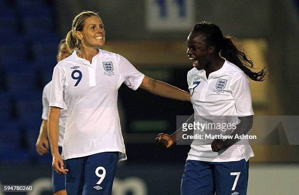 Kelly Smith of England celebrates after scoring a goal to make it 2-0 with Eniola Aluko