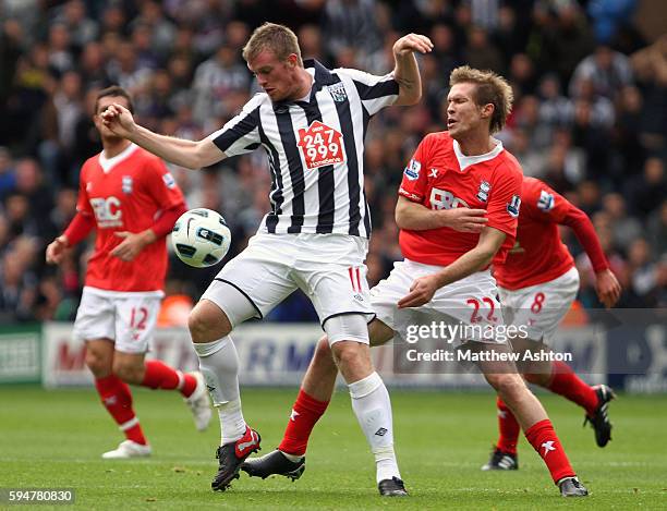 Alexander Helb of Birmingham City and Chris Brunt of West Bromwich Albion