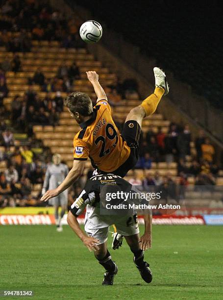 Kevin Doyle of Wolverhampton Wanderers and Jon Harley of Notts County