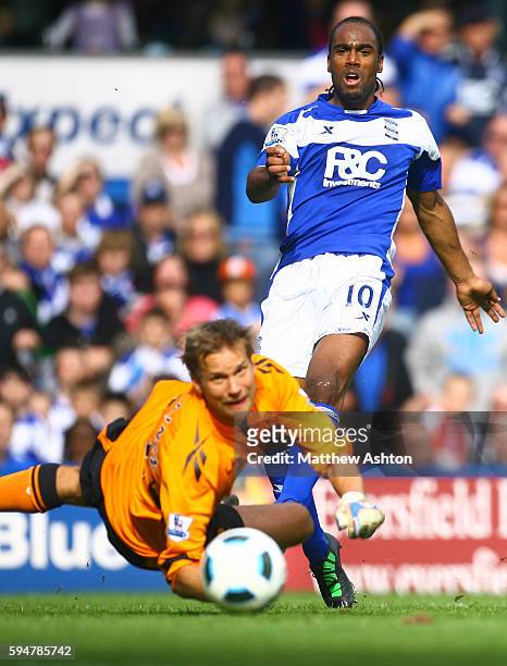 Cameron Jerome of Birmingham City beats Jussi Jaaskelainen of Bolton Wanderers only to see his shot go wide