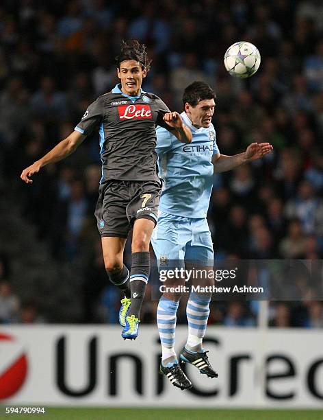 Edinson Cavani of SSC Napoli and Gareth Barry of Manchester City