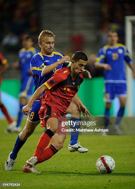 Eden Hazard of Belgium and Andrey Karpovich of Kazakhstan