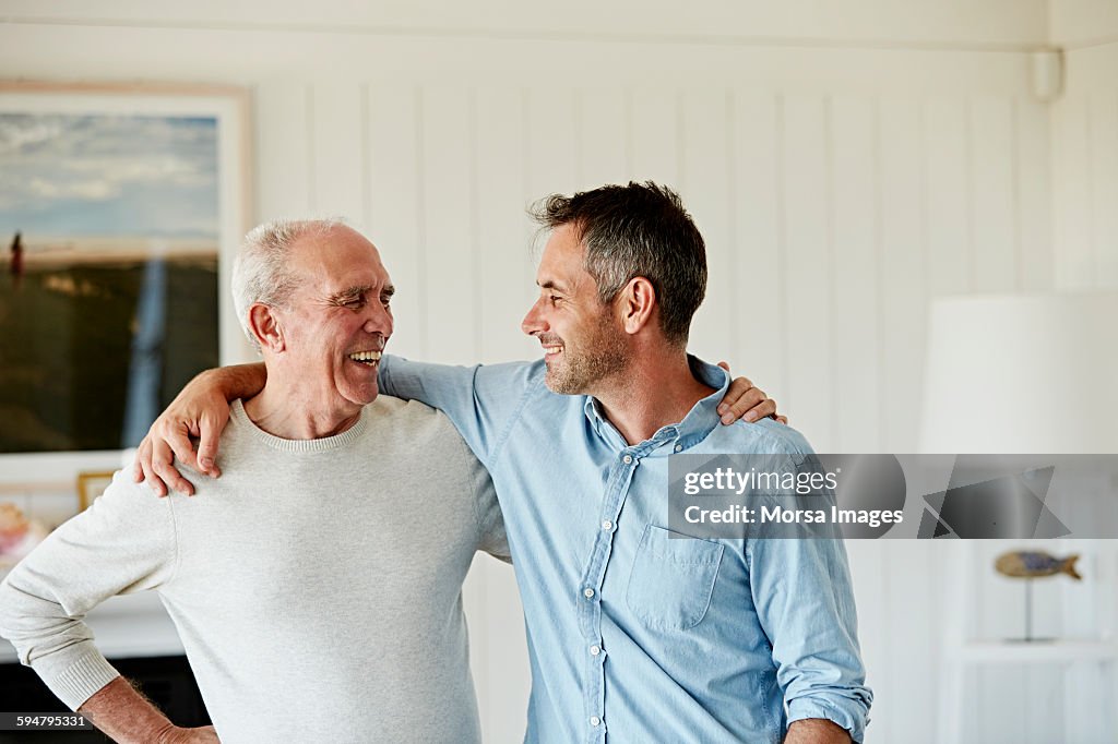 Happy father and son at home