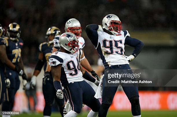 Justin Francis and Chandler Jones of the New England Patriots celebrate sacking Sam Bradford of the St Louis Rams