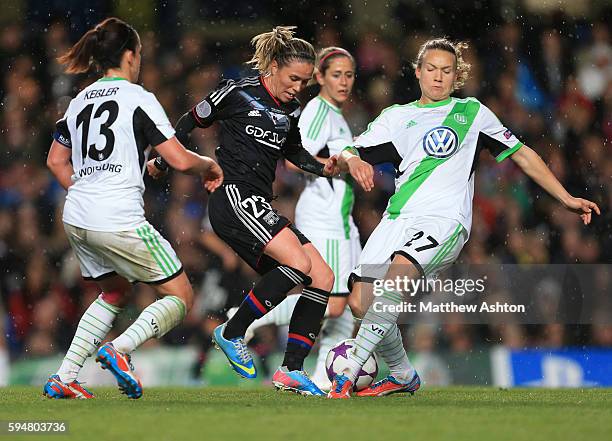 Camille Abily of Olympique Lyonnais and Josephine Henning of VfL Wolfsburg