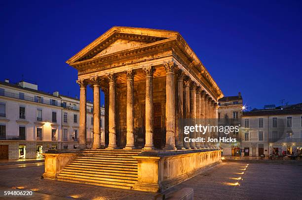 maison carree at dusk - nimes stock pictures, royalty-free photos & images