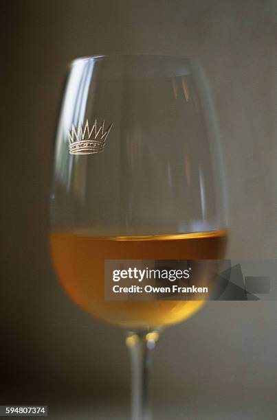 glass of sauternes white wine - sweet wine stock-fotos und bilder