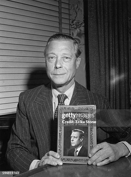The Duke of Windsor , formerly King Edward VIII, with his memoirs, entitled 'A King's Story: The Memoirs of the Duke of Windsor', circa 1951.
