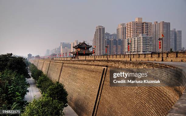 xi'an huge fortification walls and modern city - chinese porcelain stock pictures, royalty-free photos & images