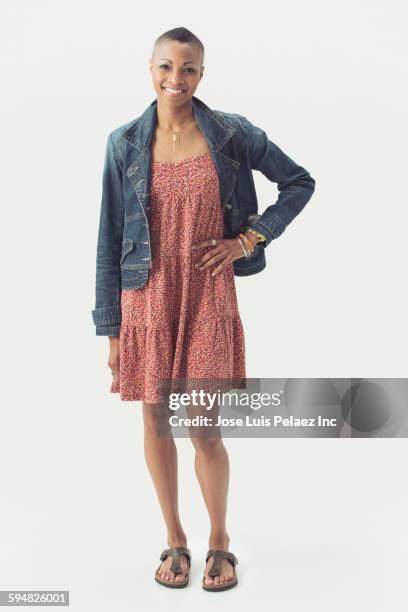 black woman smiling with hand on hip - cut out dress imagens e fotografias de stock