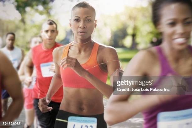 black athlete running in race - marathon stock-fotos und bilder
