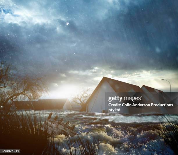 house roofs in flood - naturkatastrophe stock-fotos und bilder