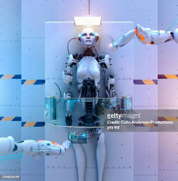 mechanical arms assembling robot - cyborg stock pictures, royalty-free photos & images