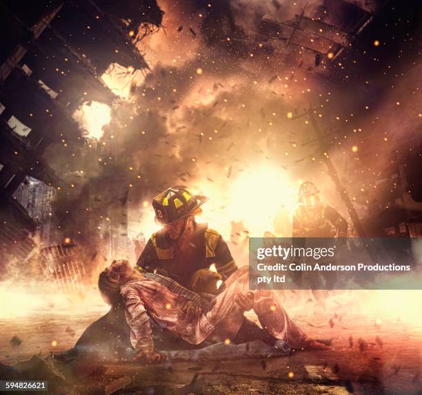 caucasian firefighter saving boy in burning building - accident victim stock pictures, royalty-free photos & images