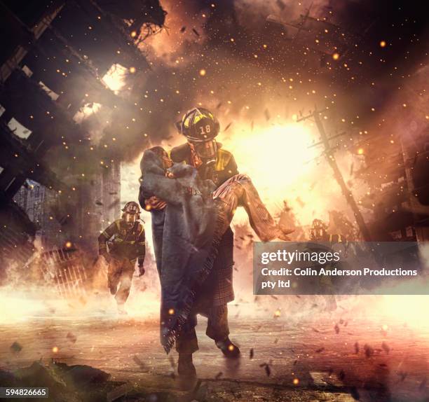 caucasian firefighter saving boy in burning building - rescue team stock pictures, royalty-free photos & images