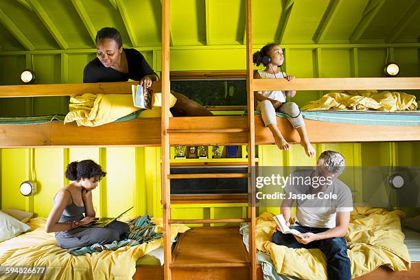 family relaxing in bunk beds at camp - kids in bunk bed stock pictures, royalty-free photos & images