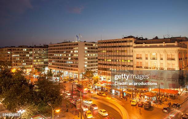 buildings at syntagma square at night, athens, greece - piazza syntagma stockfoto's en -beelden